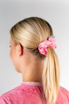Blonde girl wearing a Cira Nutrition Pink Scrunchie 